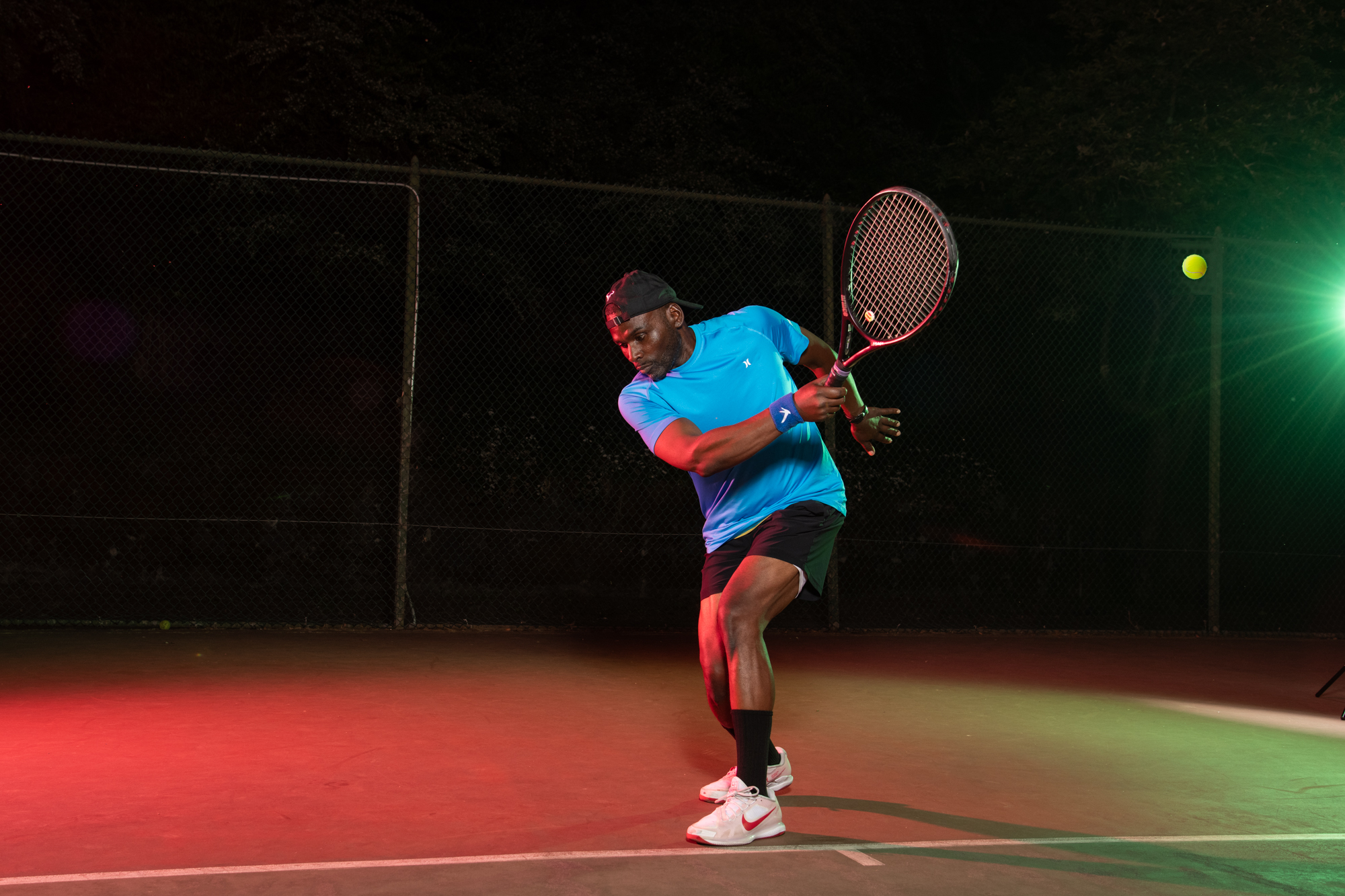 Action portrait of Darren Moore playing tennis